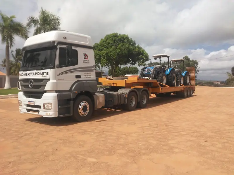 Tractors transported on a lowboy trailer